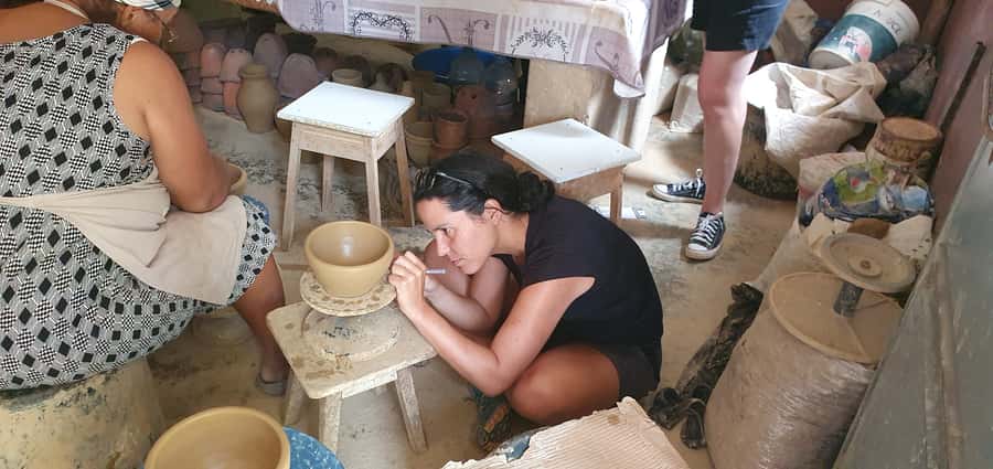 Create your own artesanal pottery with locals - Decorating the pottery before it leaves the village