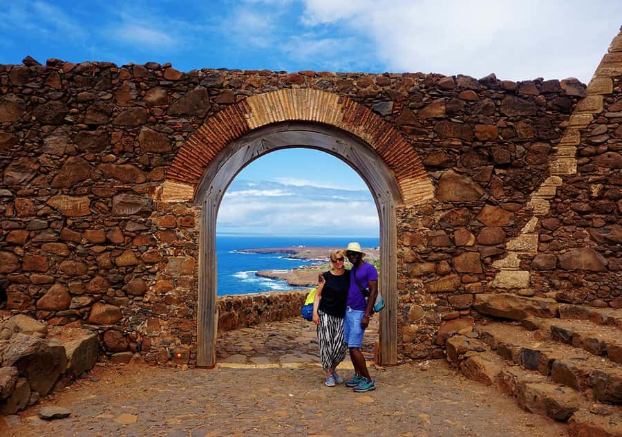 Santiago Island: Highlights of Cidade Velha with Local Guide - Black sand, fishing boats, and modern Cape Verde